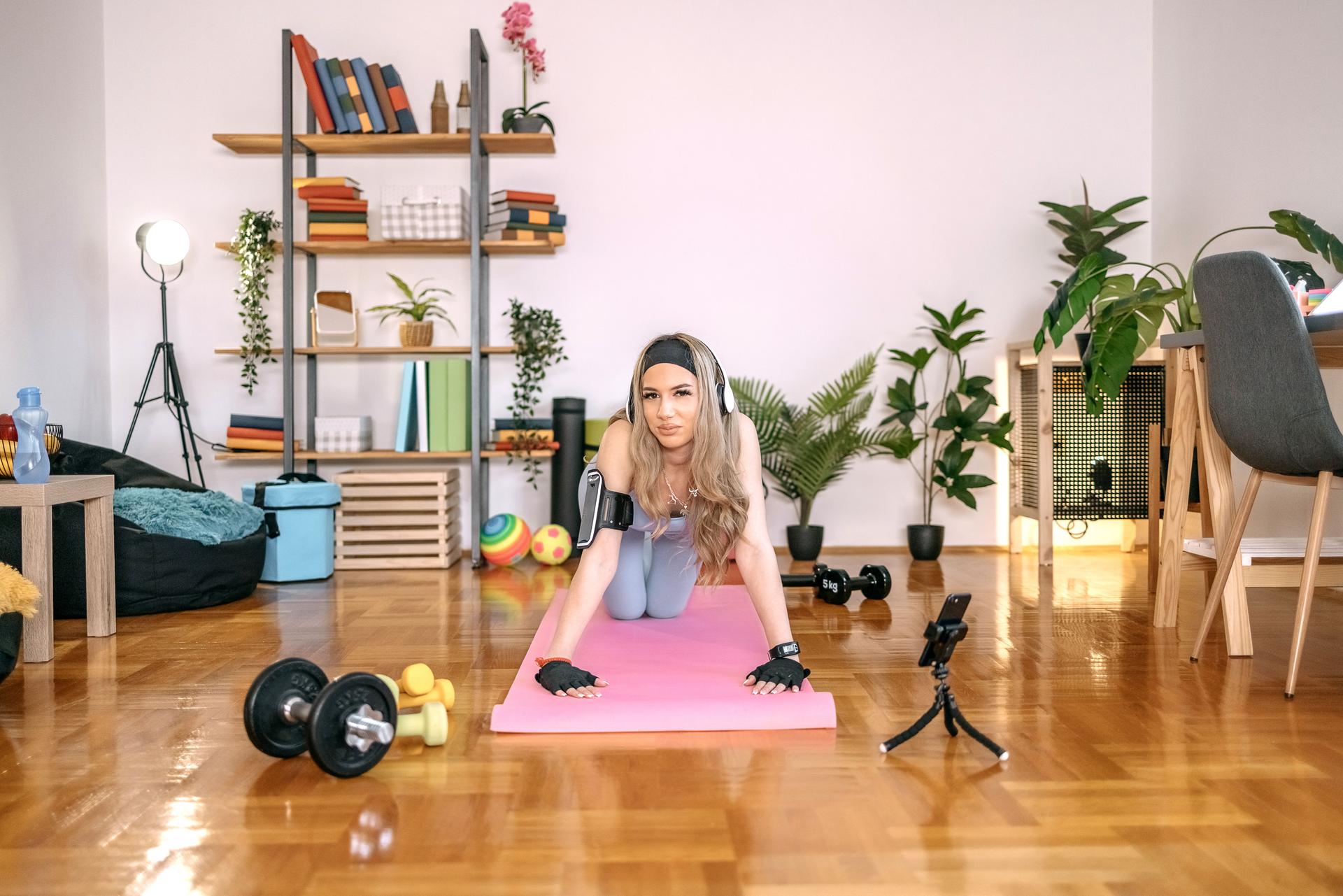 Young woman exercising at home